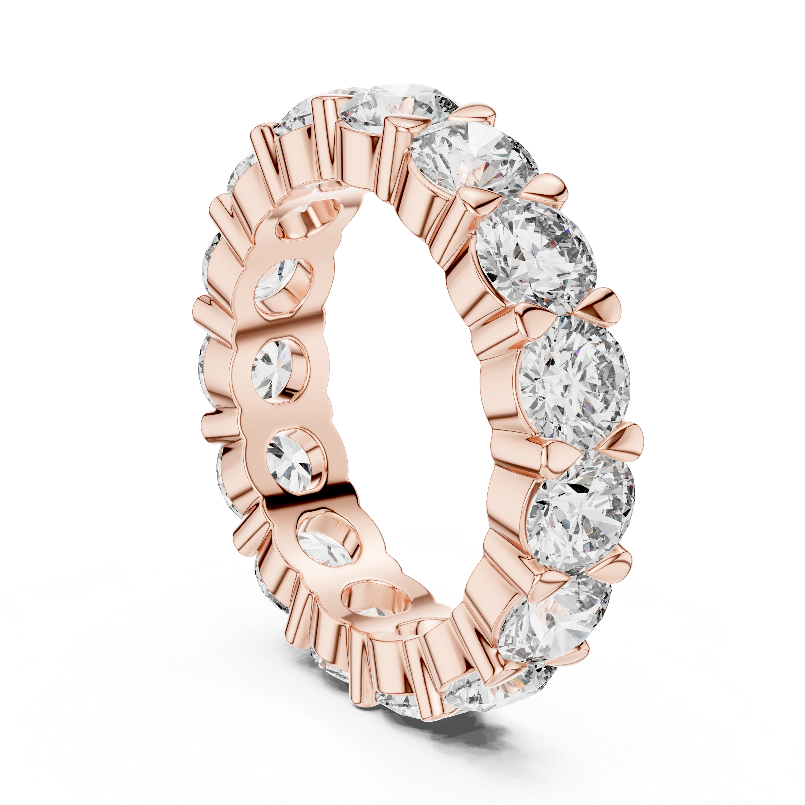 Rose gold ring with clear gemstones on a white background